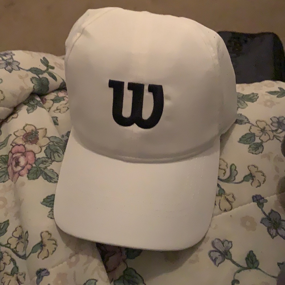 selling a wilson tennis cap adjustable in the back and comfortable on your head